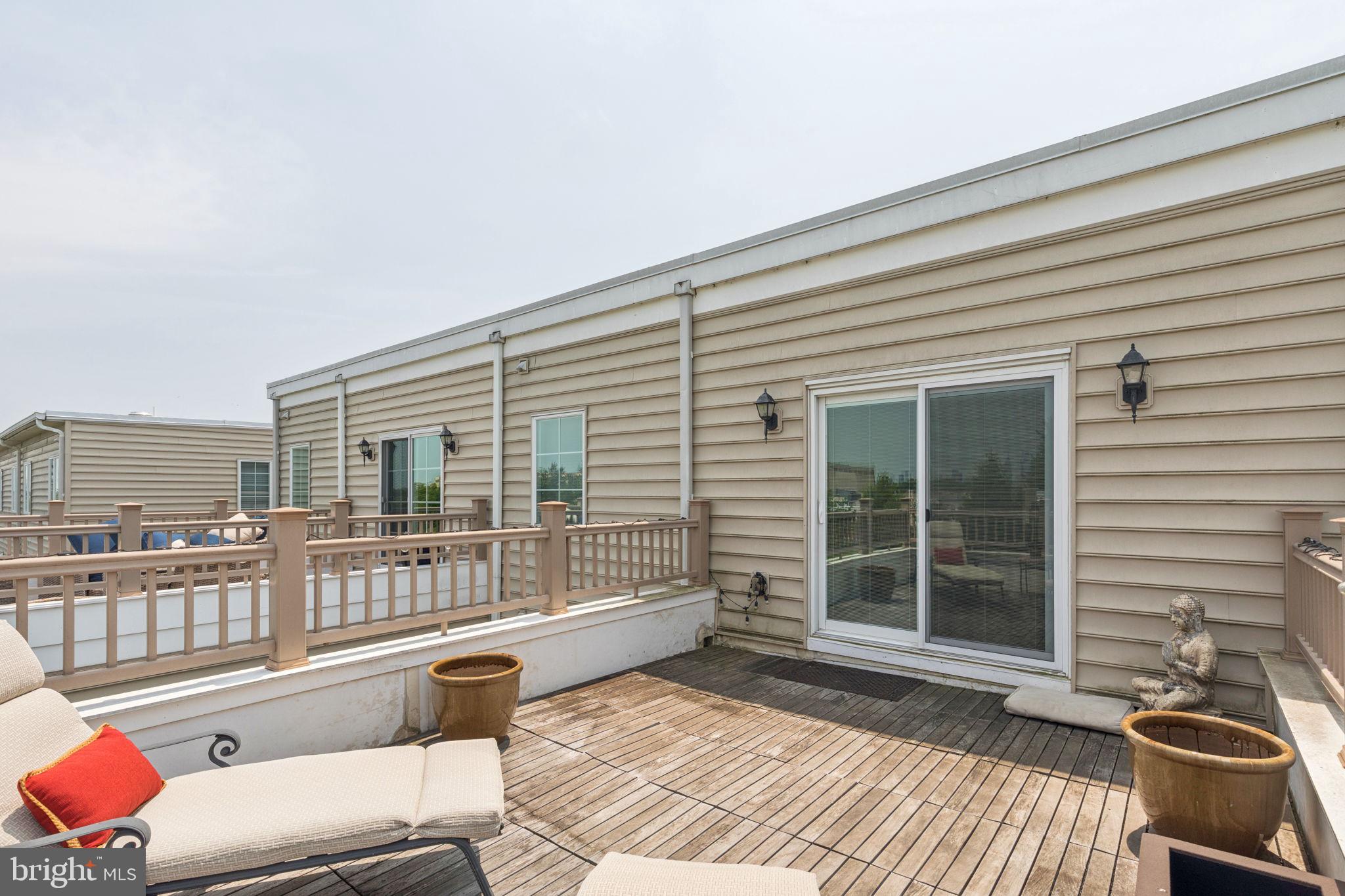 2303 Roma Drive Philadelphia, PA 19145 - Photo 79 of 80 a balcony with wooden floor and furniture