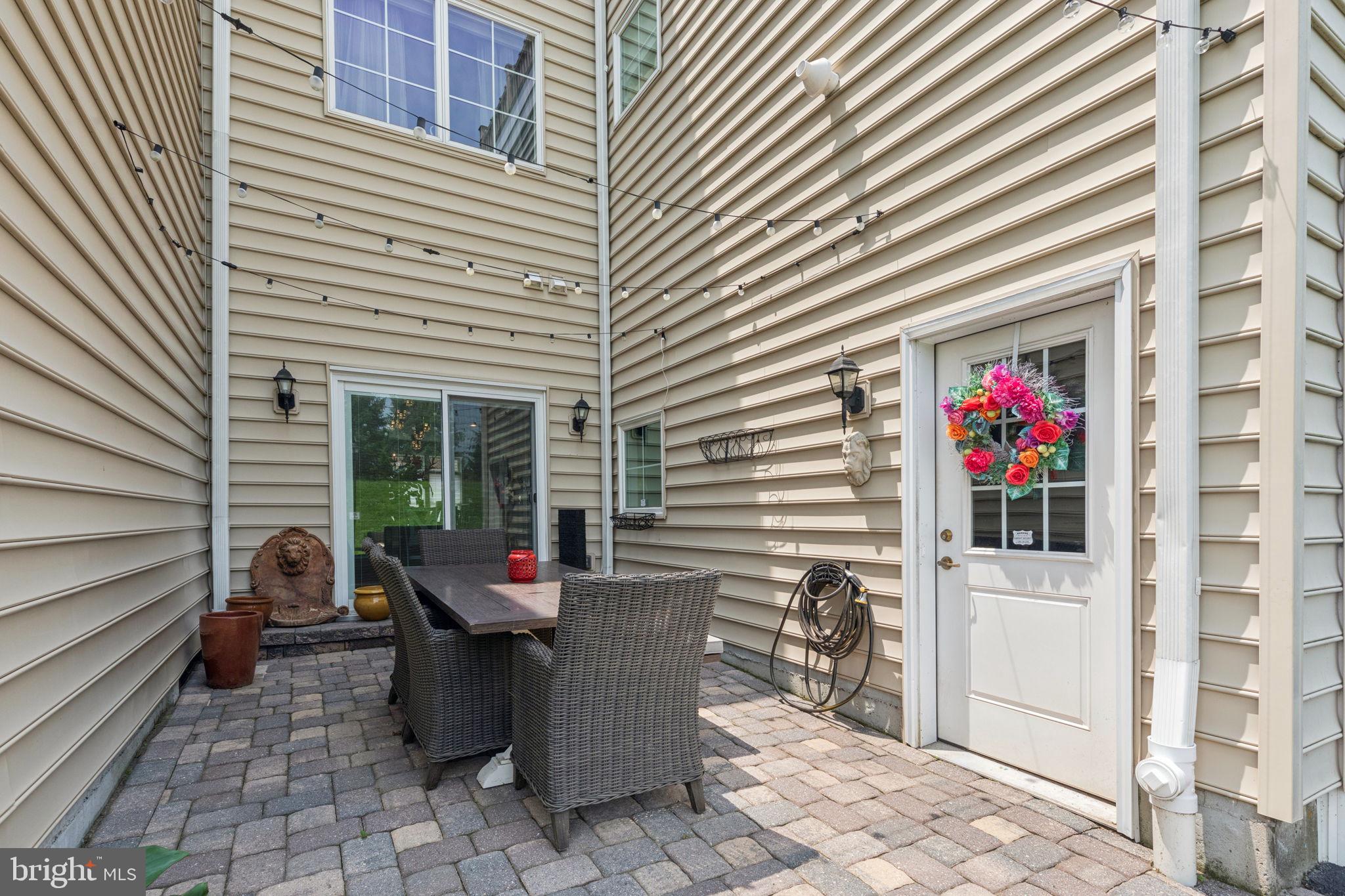2303 Roma Drive Philadelphia, PA 19145 - Photo 8 of 80 a view of a patio with table and chairs and potted plants