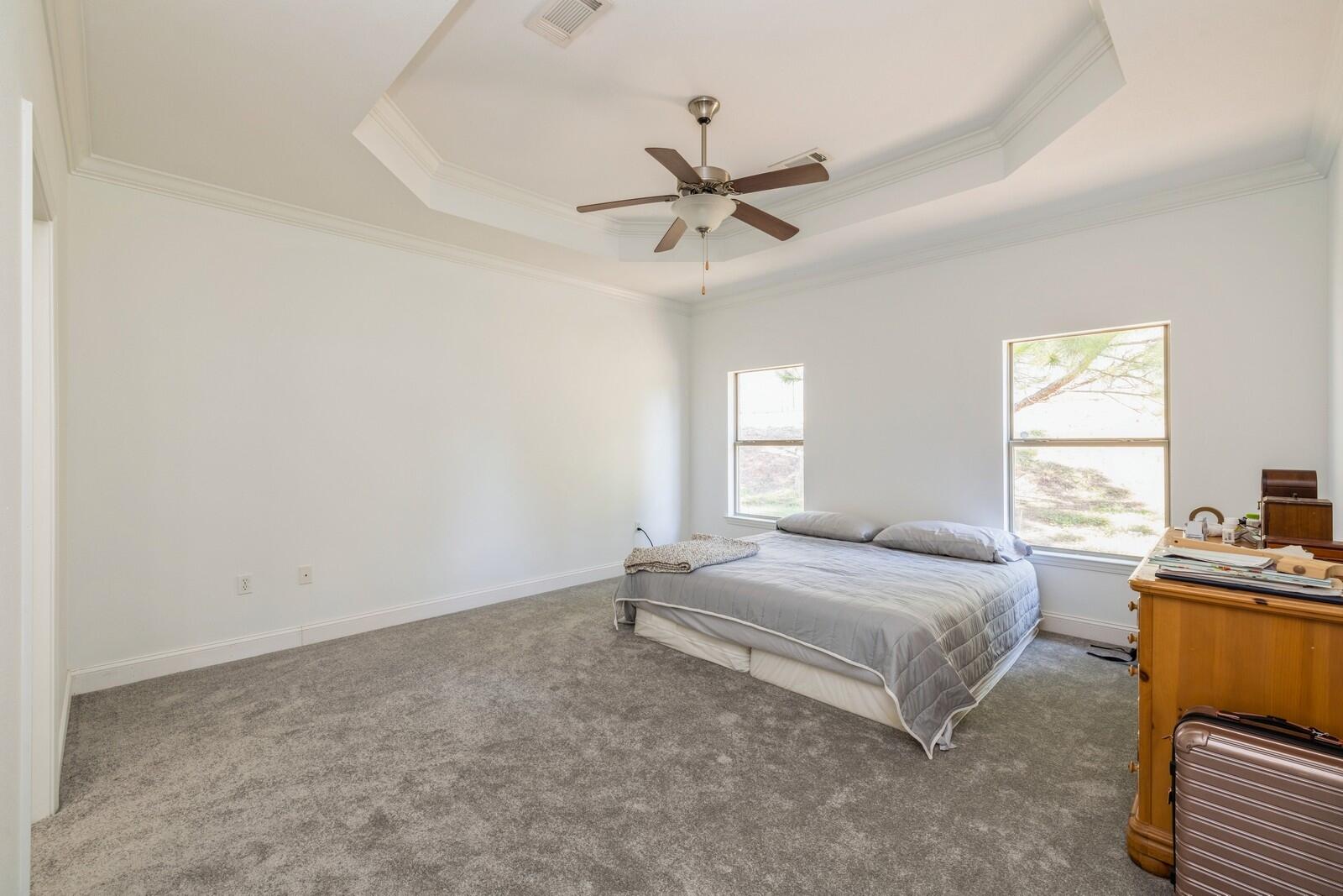 410 Wych Circle Crestview, FL 32536 - Photo 13 of 34 a bedroom with a bed and window