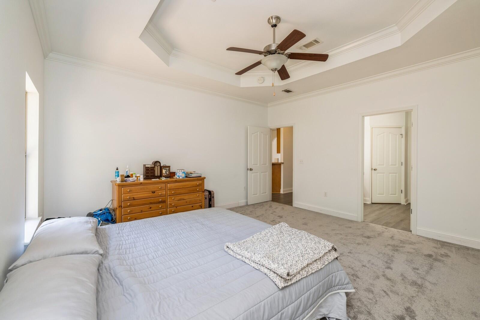 410 Wych Circle Crestview, FL 32536 - Photo 14 of 34 a bedroom with a bed and a dresser