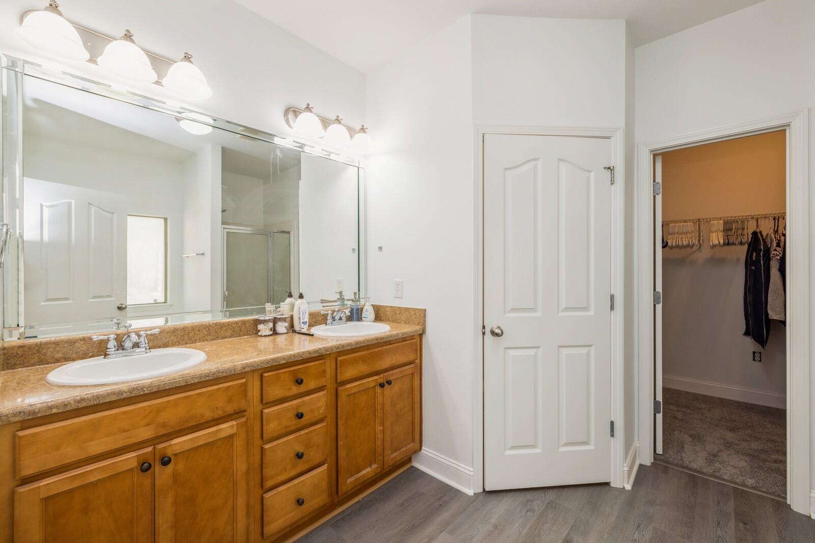 410 Wych Circle Crestview, FL 32536 - Photo 16 of 34 a bathroom with a double vanity sink and mirror