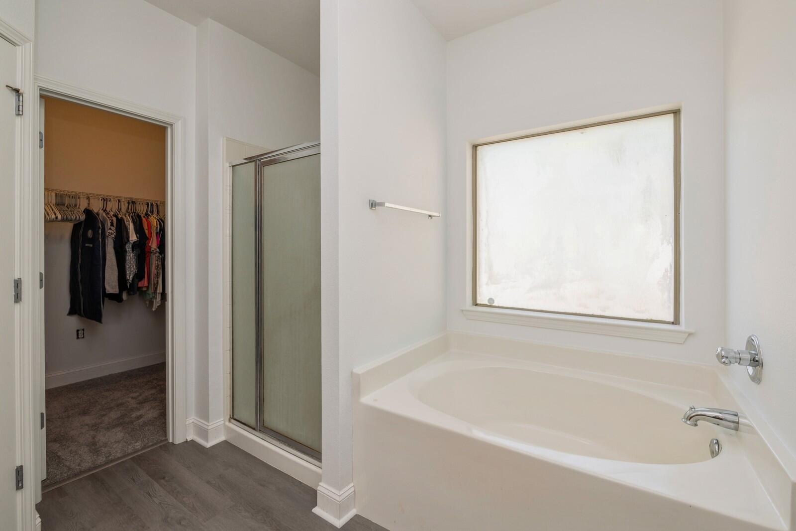 410 Wych Circle Crestview, FL 32536 - Photo 17 of 34 a white bath tub sitting next to a shower