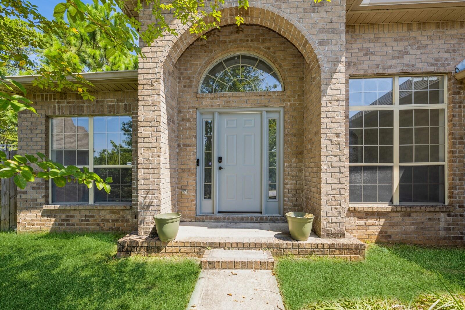 410 Wych Circle Crestview, FL 32536 - Photo 20 of 34 a front view of a house with garden