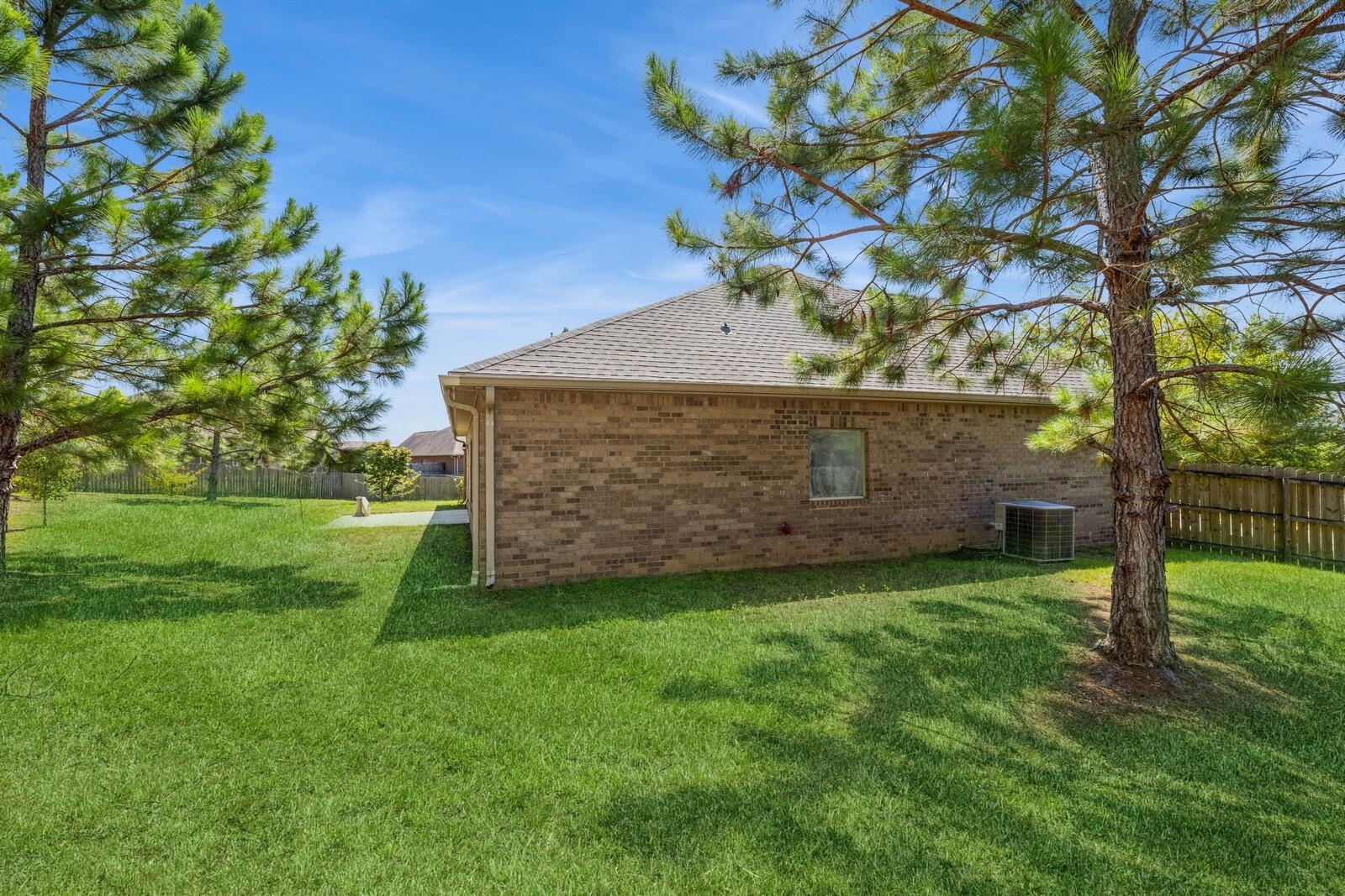 410 Wych Circle Crestview, FL 32536 - Photo 22 of 34 a view of a house with a yard