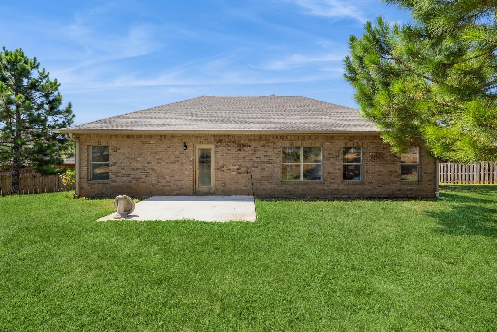 410 Wych Circle Crestview, FL 32536 - Photo 23 of 34 a front view of a house with a yard and garage