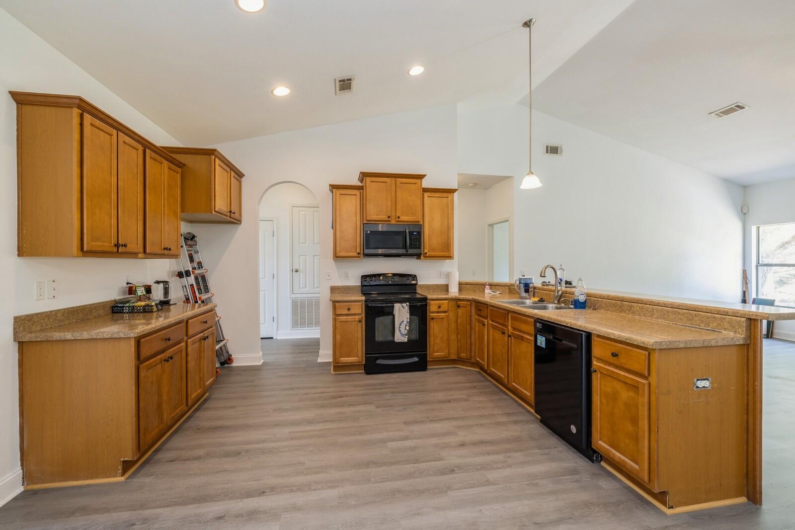 410 Wych Circle Crestview, FL 32536 - Photo 31 of 34 a large kitchen with stainless steel appliances granite countertop a stove oven and a refrigerator