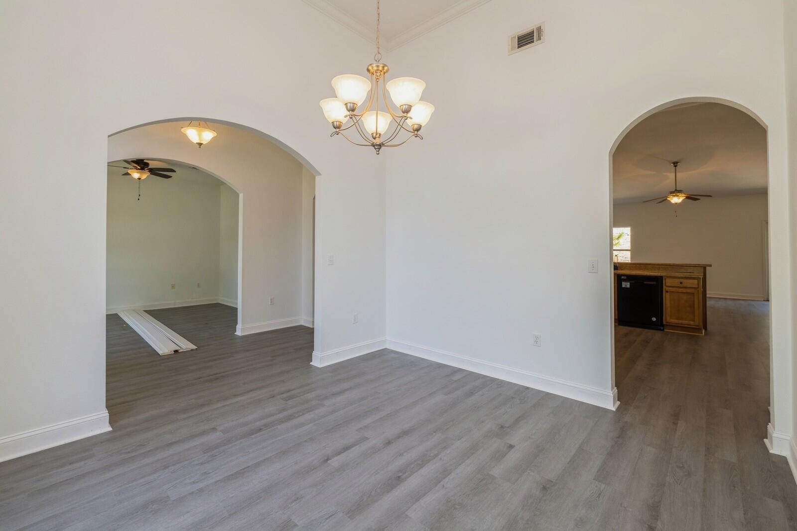 410 Wych Circle Crestview, FL 32536 - Photo 4 of 34 a view of a livingroom with a chandelier