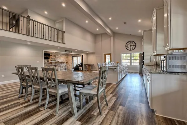a view of a dining area with furniture and wooden floor