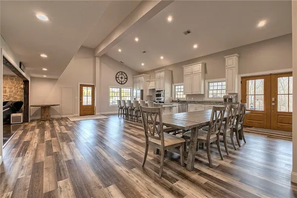 a view of a dining room with furniture window and wooden floor