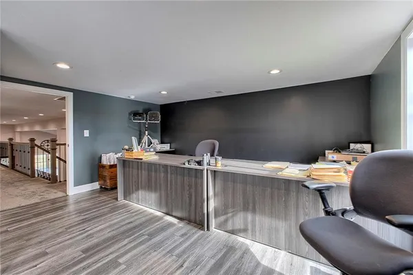 a work room with furniture and wooden floor