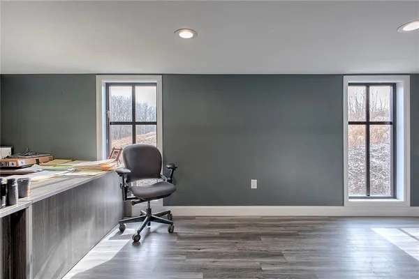 a workspace with furniture and window