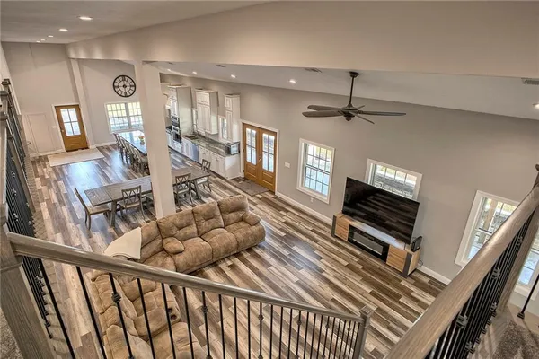 a view of a livingroom with furniture and a flat screen tv
