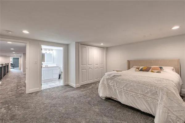 a bedroom with a bed and a view of bathroom