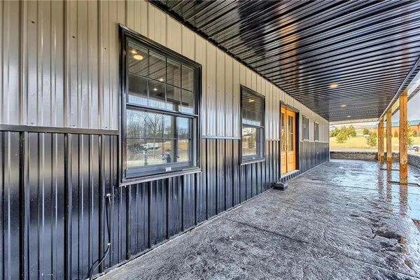 a view of a porch with wooden floor
