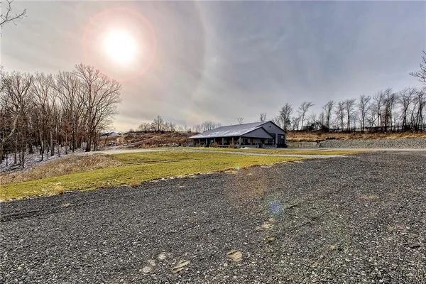 a view of a swimming pool and an outdoor space