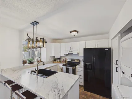 $380,000 | 9715 West Chatfield Avenue, Unit E, Littleton, CO 80128