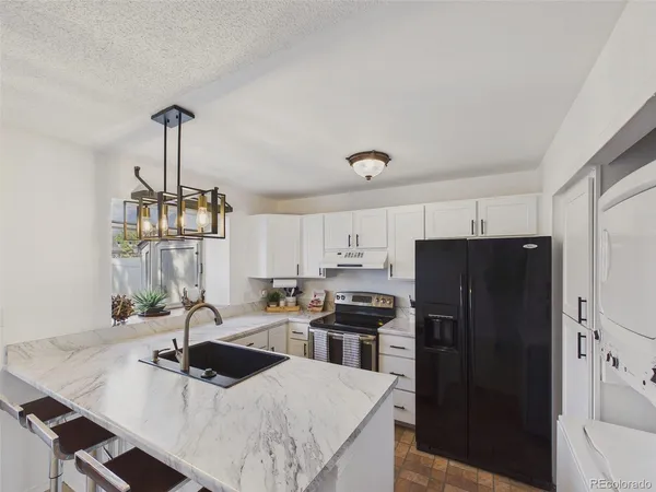 $360,000 | 9715 West Chatfield Avenue, Unit E, Littleton, CO 80128