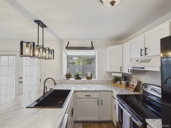 $360,000 | 9715 West Chatfield Avenue, Unit E, Littleton, CO 80128