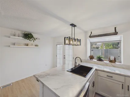 $380,000 | 9715 West Chatfield Avenue, Unit E, Littleton, CO 80128