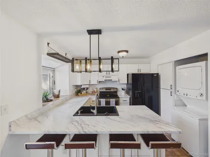 $380,000 | 9715 West Chatfield Avenue, Unit E, Littleton, CO 80128