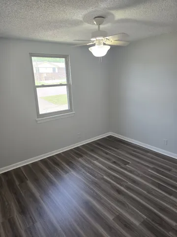 a view of a brick building with many windows