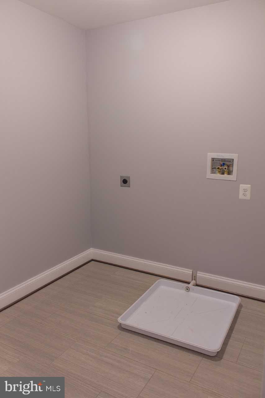 106 German Hill Road Baltimore, MD 21222 - Photo 24 of 29 Spacious Laundry Room on the Upper Level
