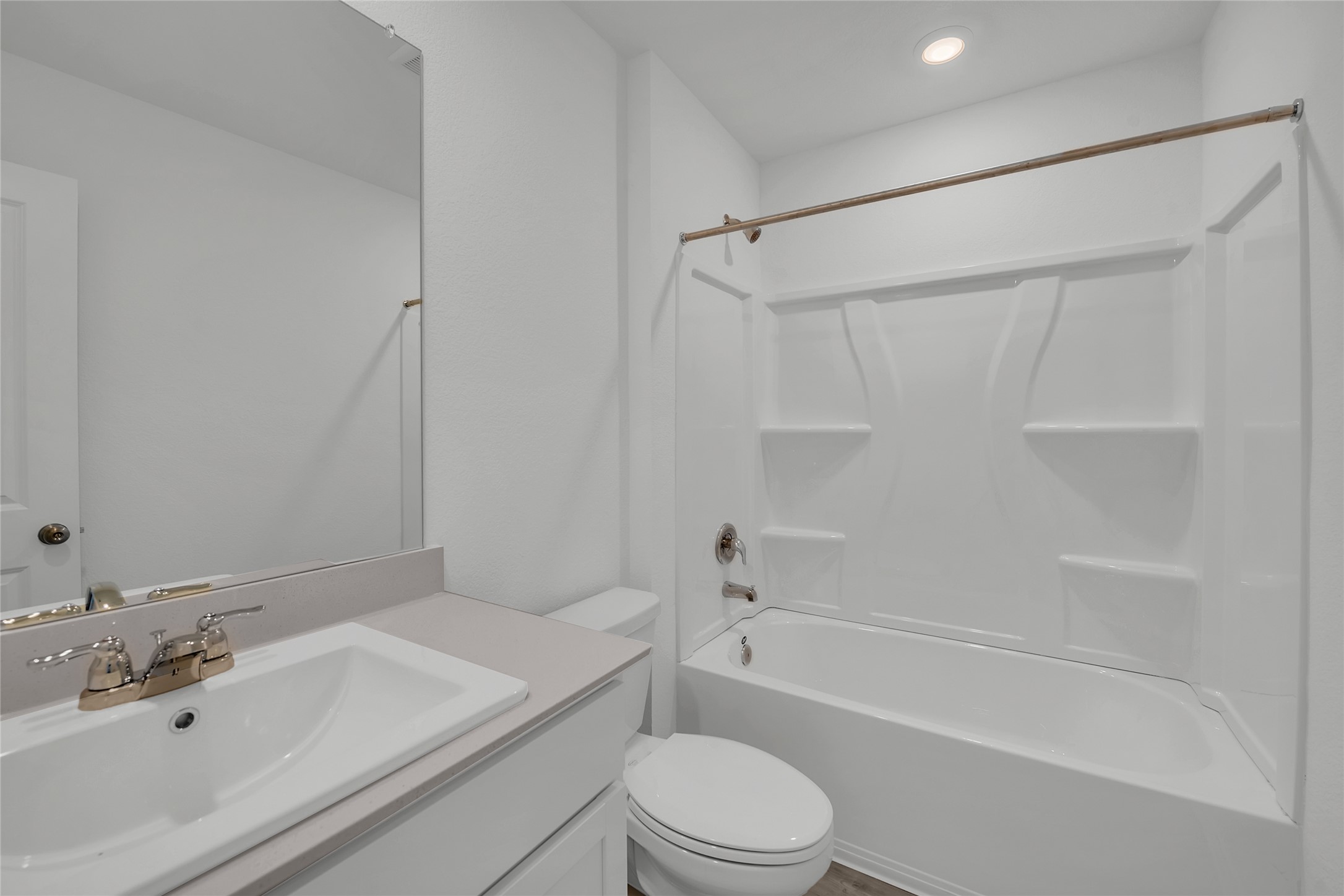 309 Marty Allen Loop Jarrell, TX 76537 - Photo 14 of 33 Bathroom featuring a white integrated tub/shower unit with storage shelves