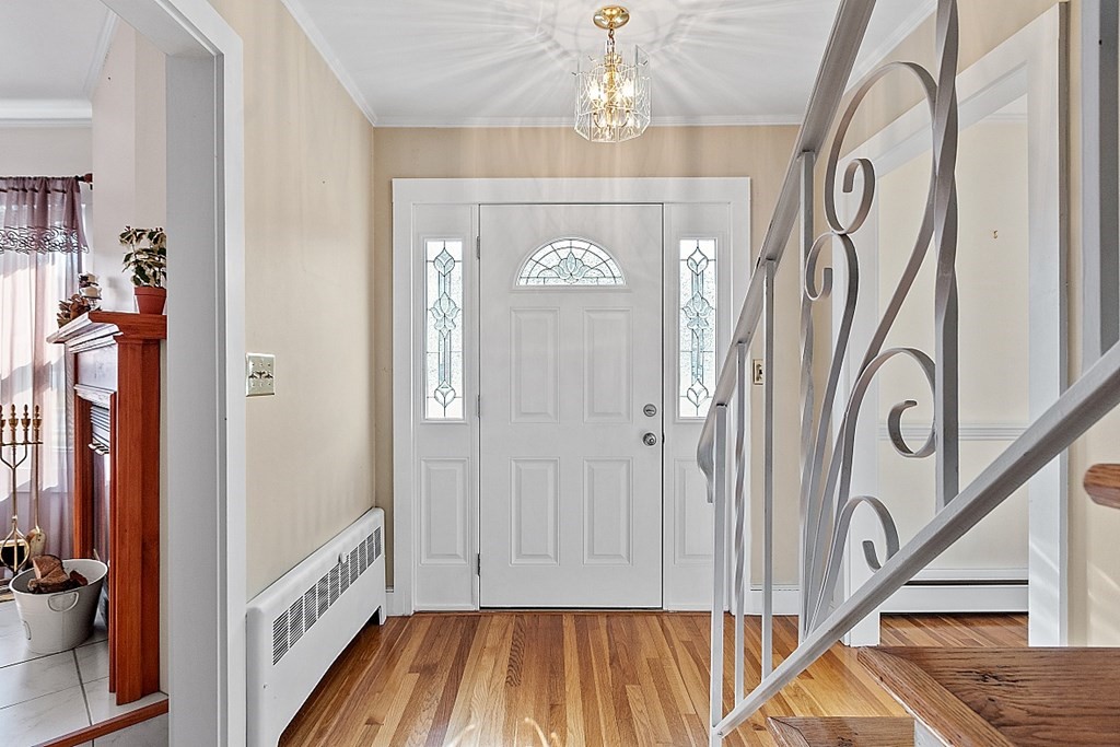 19 South Hampton Road Amesbury, MA 01913 - Photo 30 of 42 a view of a hallway with wooden floor and staircase