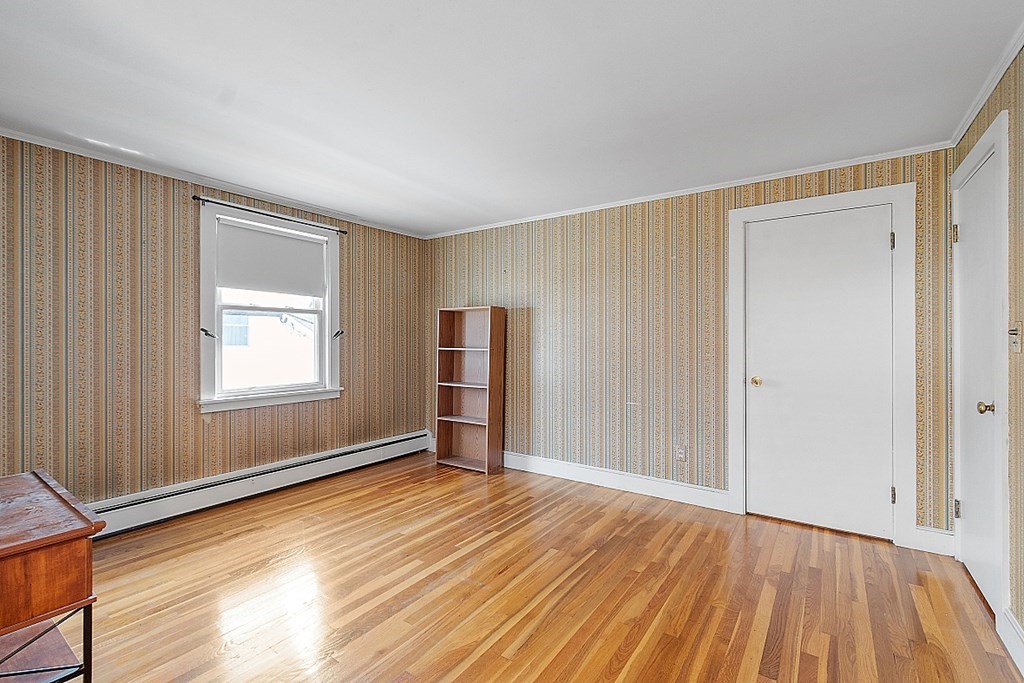 19 South Hampton Road Amesbury, MA 01913 - Photo 33 of 42 a view of an empty room with wooden floor and a window