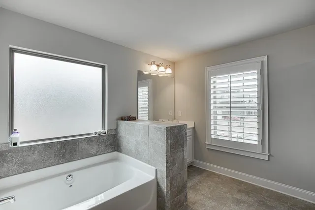 a bathroom with a sink double vanity and a mirror