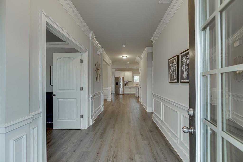 914 Rainsong Court Braselton, GA 30517 - Photo 2 of 37 a view of hallway with wooden floor