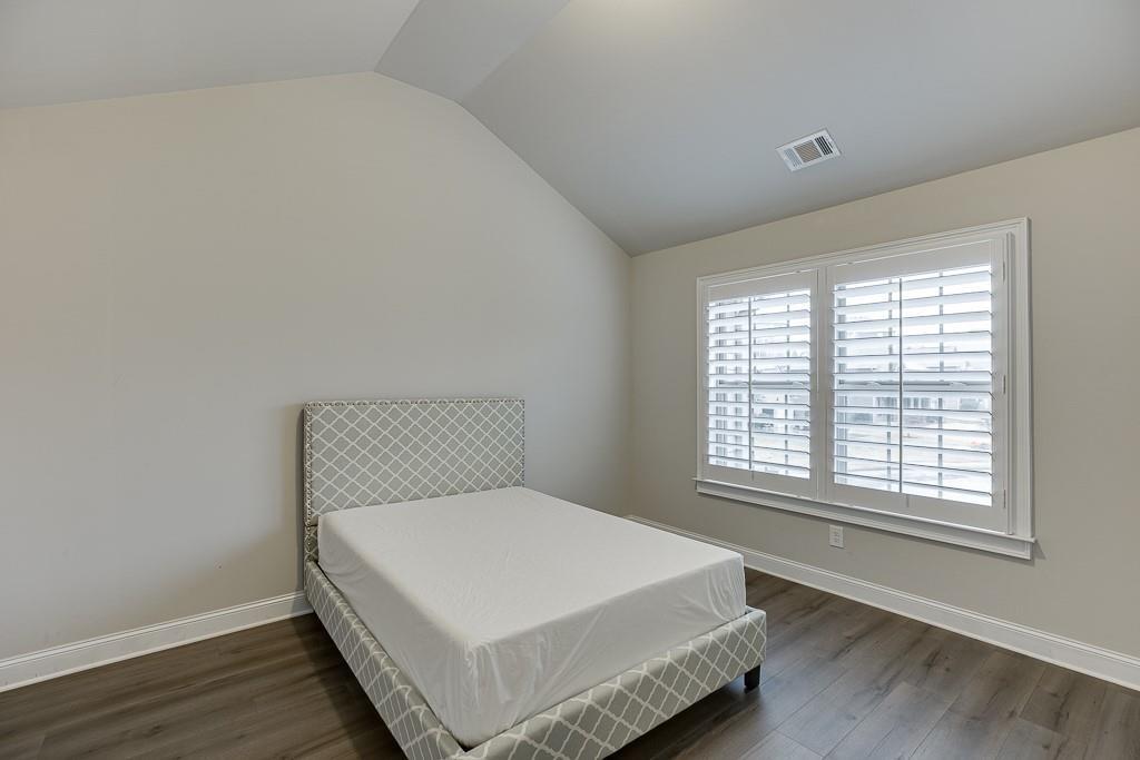 914 Rainsong Court Braselton, GA 30517 - Photo 28 of 37 a large bed sitting in a bedroom next to a window