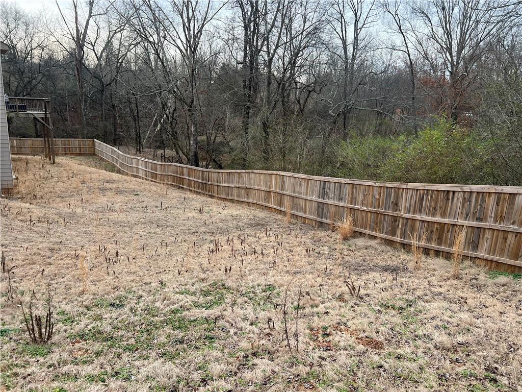 914 Rainsong Court Braselton, GA 30517 - Photo 37 of 37 a backyard of a house with lots of green space