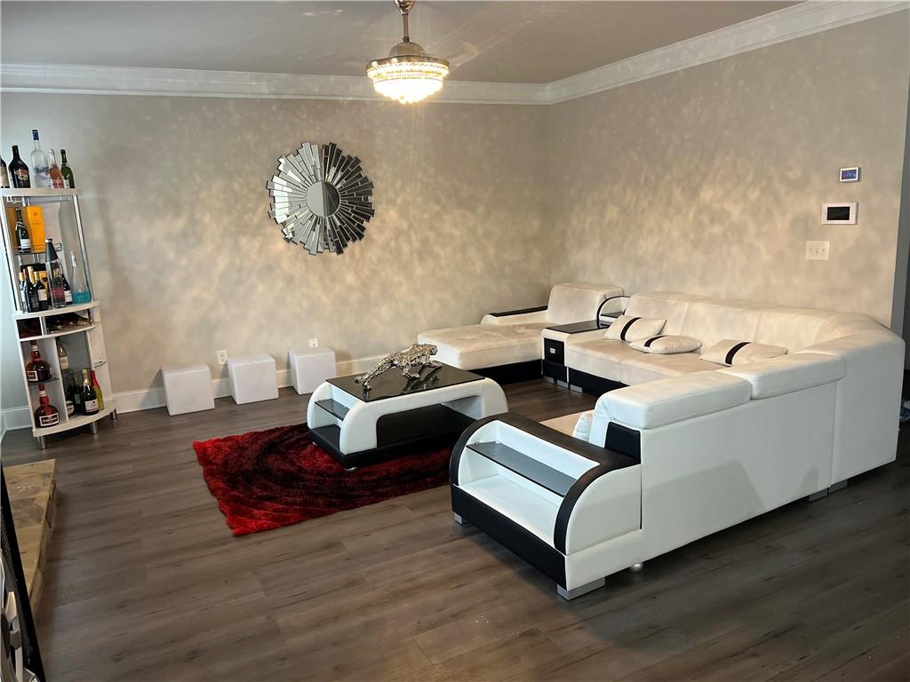 914 Rainsong Court Braselton, GA 30517 - Photo 9 of 37 a living room with furniture and wooden floor