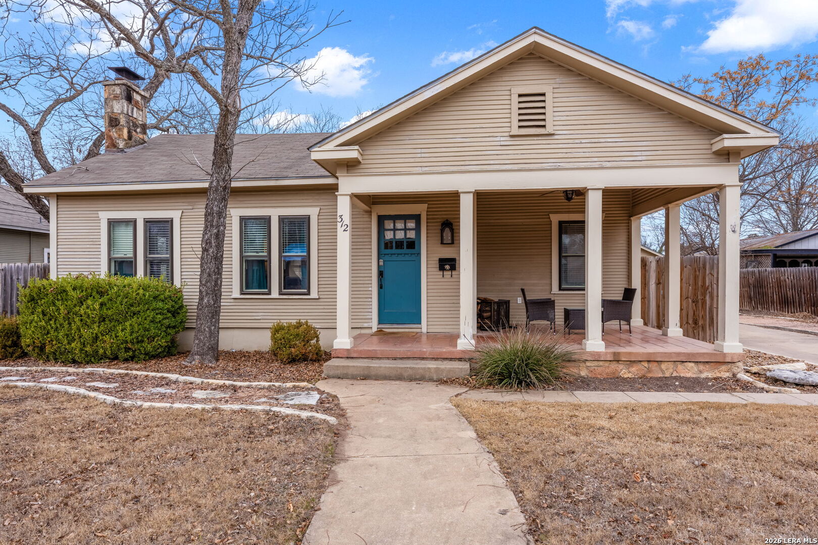 312 Lytle Street Kerrville, TX 78028 - Photo 1 of 17 a front view of a house with garden
