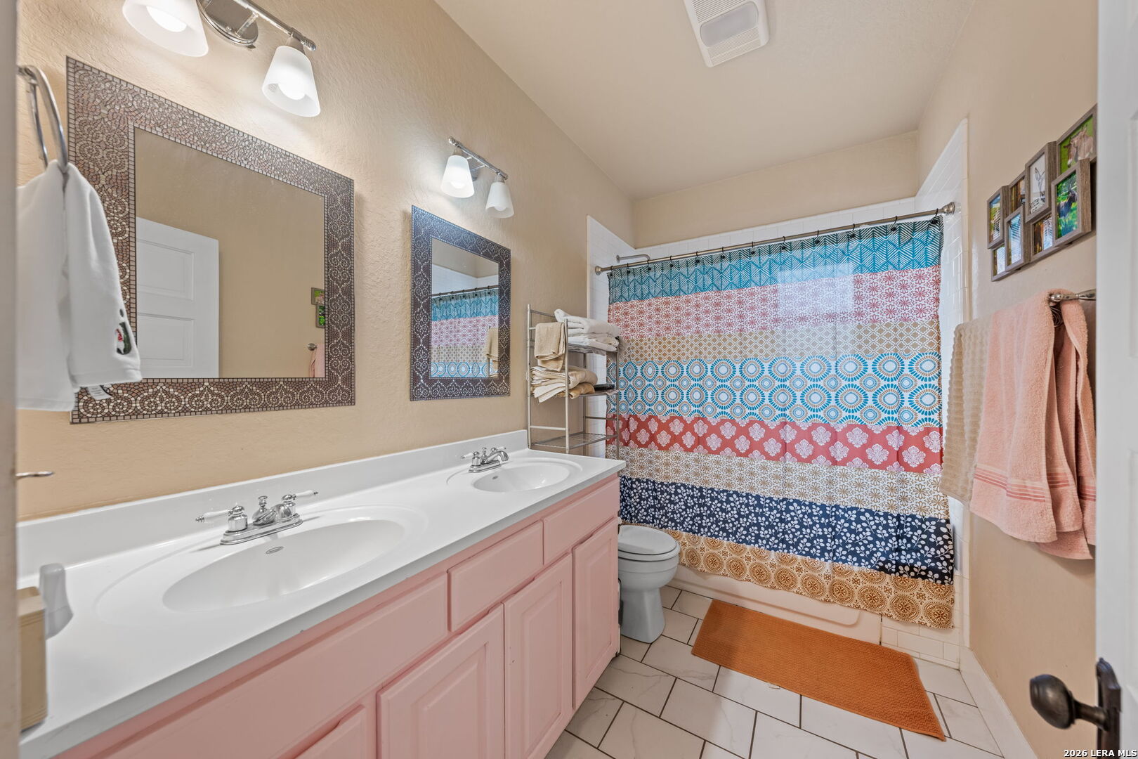 312 Lytle Street Kerrville, TX 78028 - Photo 11 of 17 a bathroom with a sink and a mirror