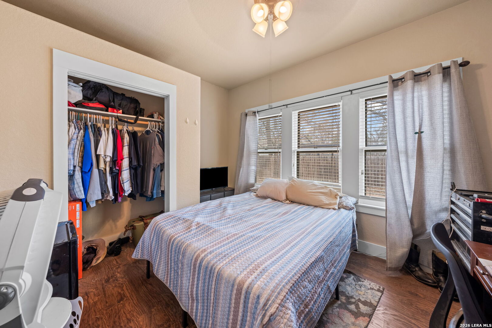 312 Lytle Street Kerrville, TX 78028 - Photo 9 of 17 a bedroom with a bed and a flat tv screen