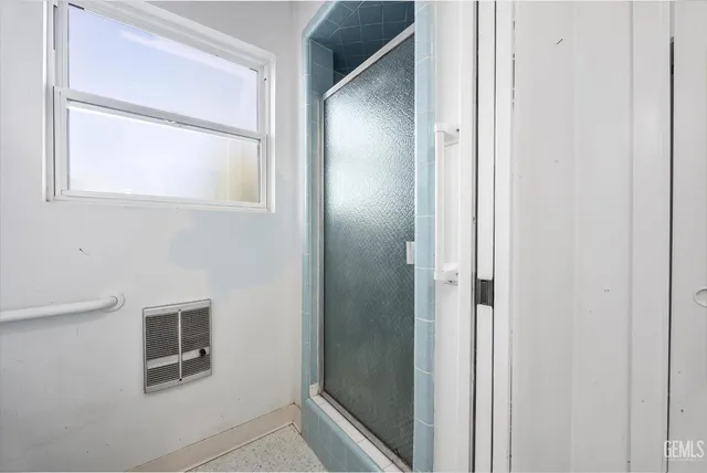 a bedroom with bed and window