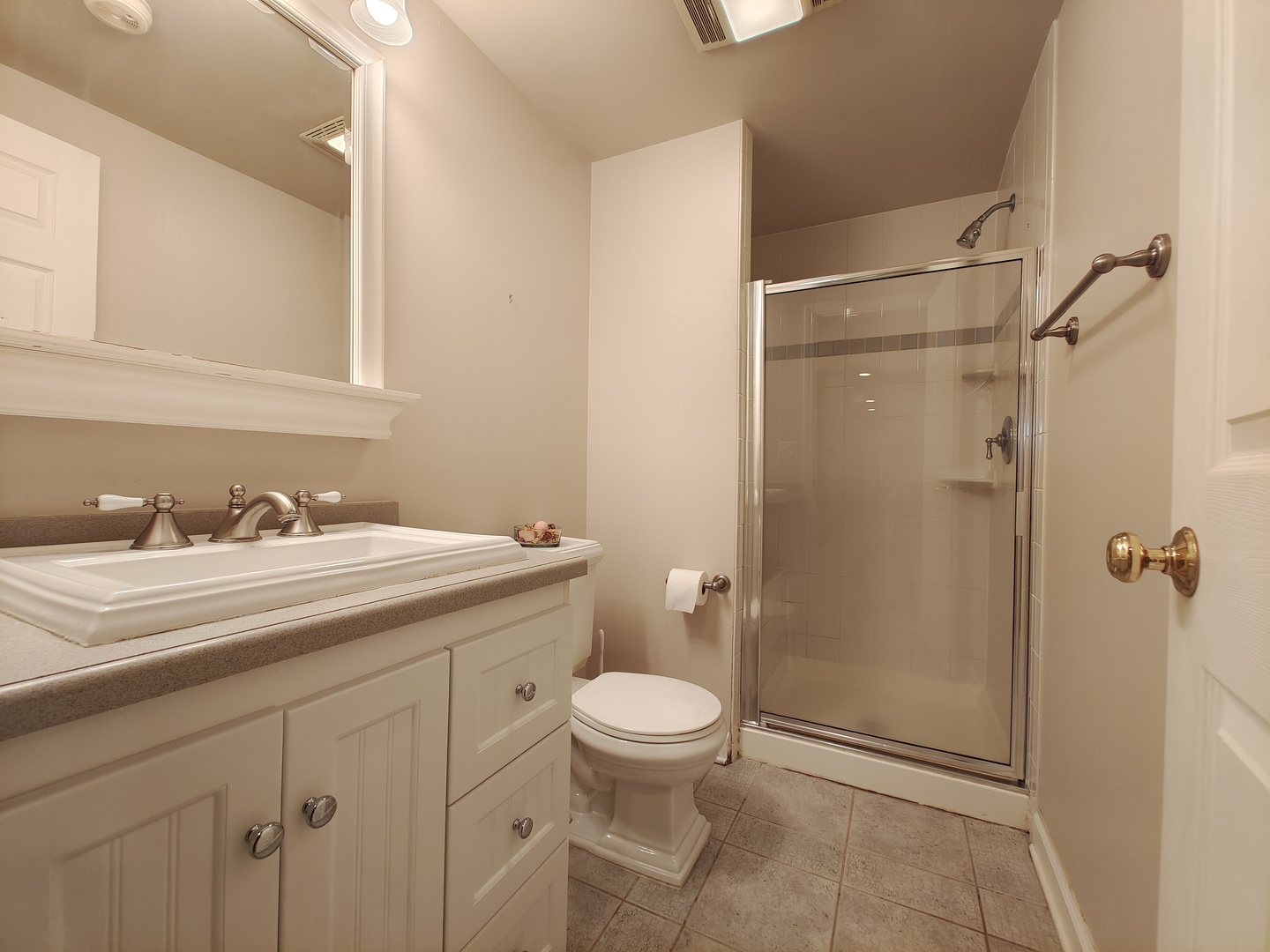 4807 Snapjack Circle Naperville, IL 60564 - Photo 26 of 29 a bathroom with a granite countertop sink toilet mirror and a shower