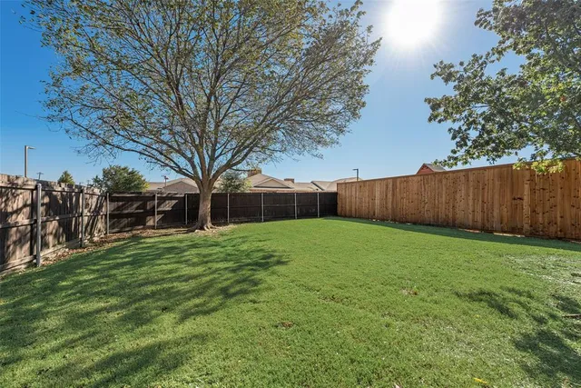 a view of a house with a yard porch and sitting area