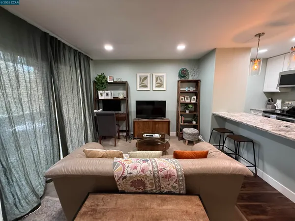 a bedroom with furniture and a fireplace