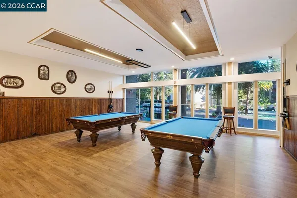 a room with furniture and pool table