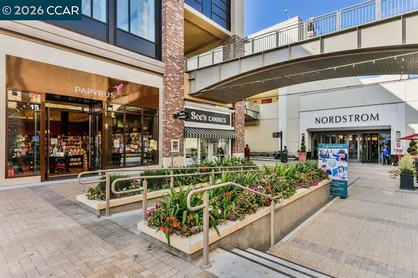 an outdoor living area with furniture