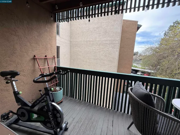 a view of a balcony with furniture
