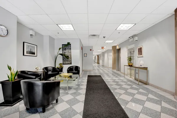 a dining hall with granite countertop a rug a stove a rug and a window