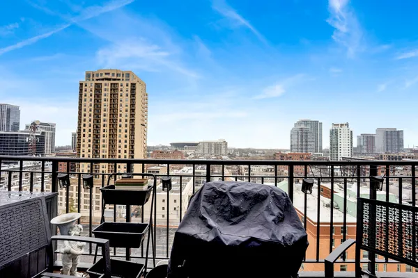 a view of a balcony with two chairs and a table