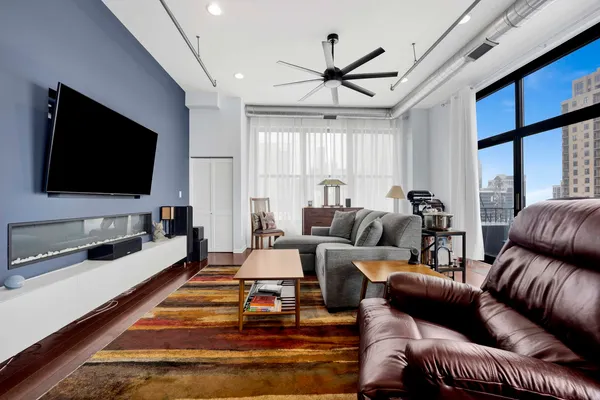 a living room with furniture and a flat screen tv