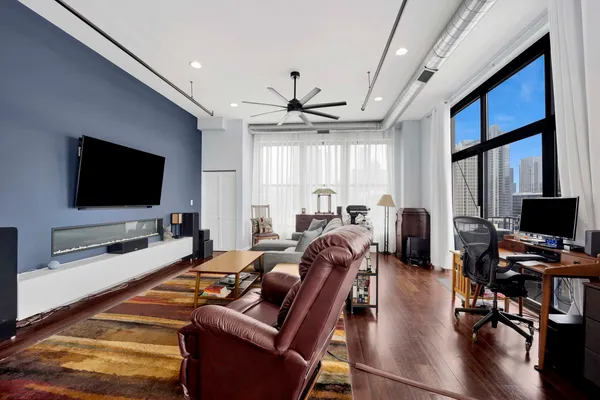 a living room with furniture and a flat screen tv