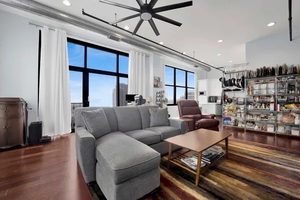a living room with furniture and a rug