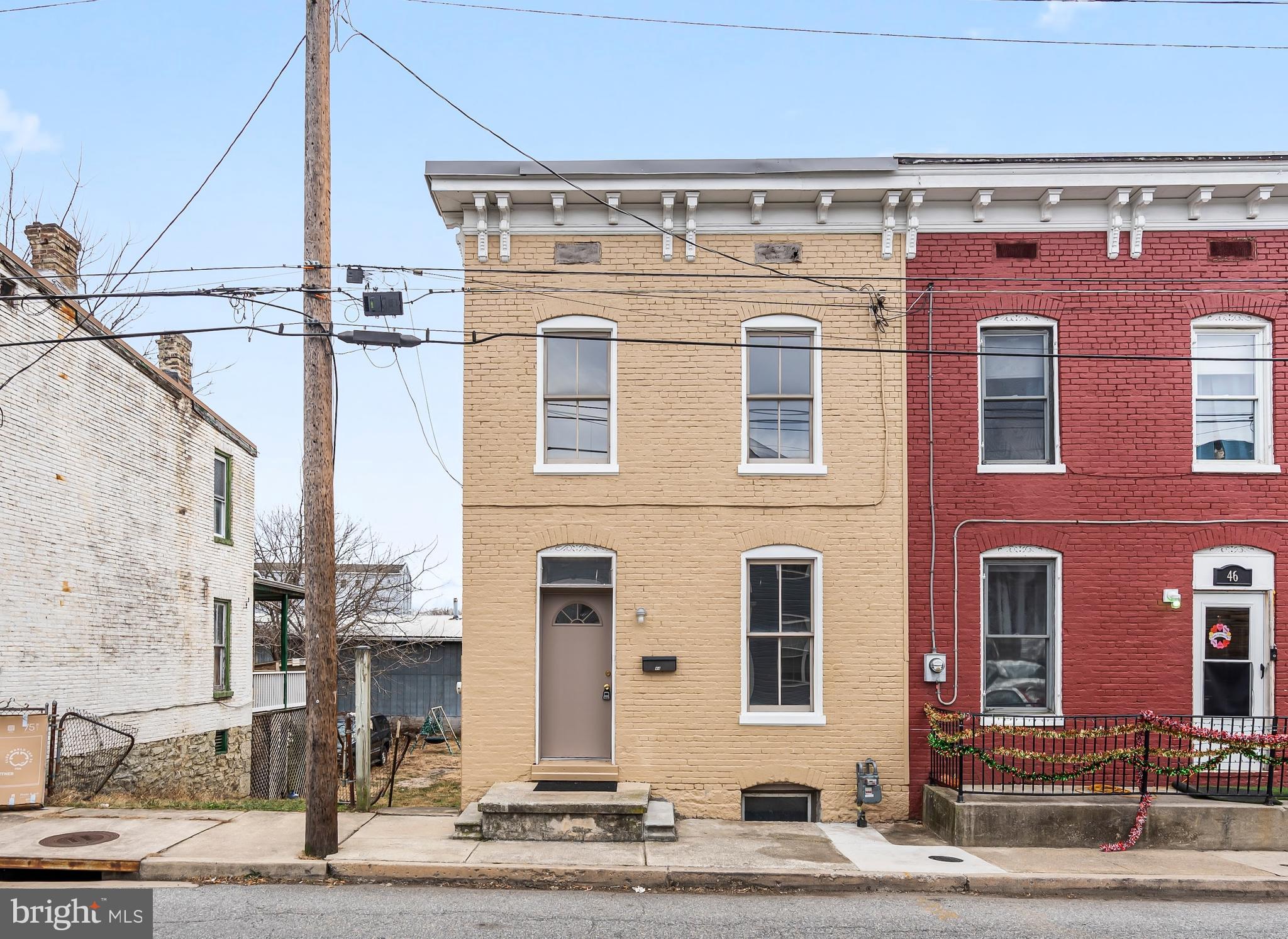 a front view of a building with street view